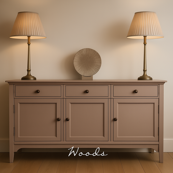 Large sideboard painted in Woods Autentico Paint. Two tall lamps on the sideboard. A brown wooden floor and neutral toned wall to finish the scene.