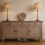 Large sideboard painted in Woods Autentico Paint. Two tall lamps on the sideboard. A brown wooden floor and neutral toned wall to finish the scene.